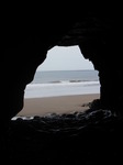 SX13994 Small waves breaking on beach from cave.jpg